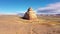 Church rocks monument beige color in dry desert aerial view