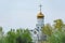 Church saint Nicholas with golden domes and place religion of orthodox christian.