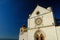 Church of San Francesco in Assisi with the stone wall. The basilica built in Gothic style houses the frescoes by Giotto