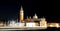 Church of San Giorgio with illuminated bell tower and the wake o