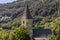 The Church of San NicolÃ² with the Benedictine Abbey of Monte Maria in the background, Burgusio, South Tyrol, Italy