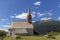 The church of Sant`Anna overlooking Lake Resia in Curon Venosta Graun, South Tyrol, Italy
