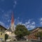 The church of Santa Maria Assunta and the town hall of Silandro, Val Venosta, South Tyrol, Italy, on a sunny day