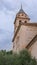 Church of Santa Maria de Alhambra near to the palace of Carlos V in cloudy day. Granada, Spain, Andalusia