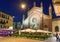 Church Santa Maria del Carmine and square with restaurant at night in Milan