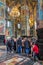 Church of the Savior on Blood.Visitors of the church and a tired woman sleeping on a chair.