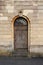 Church side door with skull and bones