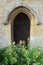 Church side door with wild flowers