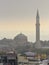 Church of St. Irina and the minaret of St. Sophia in the morning mist