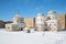 The church of St. Nicholas and cathedral of the Assumption within the walls of the Ivangorod fortress, sunny march afternoon. Ivan