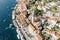 Church of St. Nicholas with a high bell tower among ancient houses. Perast, Montenegro. Drone