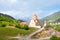 Church of St. Nicholas on the hill of mountains background in Mestia, Georgia