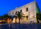 The Church of St Titus, or Agios Titos, in centre of Heraklion, Crete, at night with an almost full moon above it.