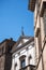 Church with a stags head over the facade in Rome Italy that has books as the main theme