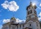 Church to St. Grand Prince Alexander Nevsky in Pudozh after restoration. Orthodox temple and bell tower against blue sky in summer