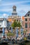 Church tower and cafe on Rhine canal, Leiden, Netherlands