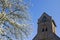 Church tower and flowering magnolia tree, Welsum