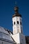 Church tower of the parish church in the village of Sachrang in winter