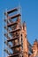 Church tower renovation against a blue sky