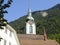 Church tower and spire seen against the blue sky