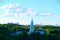 Church, view from the hill, a lot of trees around