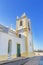 Church in the village of Ferragudo. View of the bell and cross religious.