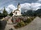 Church and well-tended graves in Swiss cemetery