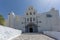 Church with white bell tower in Pyrgos Kallistis, Santorini island