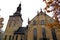 Church with a yellow brick facade with arcades and architectural decorations