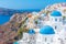 Churches and blue cupolas of Oia town at Santorini, Greece