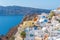 Churches and blue cupolas of Oia town at Santorini, Greece