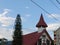 churches and trees with a beautiful and charming blue sky in the background