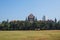 Churchgate, Mumbai, Maharashtra in a clear, sunny day; lawn with cricket players