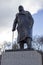 Churchill Statue shows Winston Churchill standing with his hand resting on his walking stick