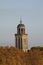 Churchtower behind colorful trees in autumn, Deventer, The Netherlands