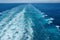 The churning blue water of a cruise ship wake on the Atlantic Ocean