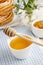 Churro donut and bowl of honey