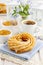 Churro donuts and bowl of honey