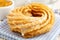 Churro donuts and bowl of honey