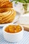 Churro donuts and bowl of honey