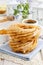 Churro donuts and bowl of honey