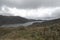 Chuza reservoir panorama with andean mountains and paramo ecosystem inside chingaza national natural park