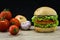 Ciabatta and falafel burger with vegetables on wood