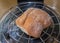 Ciabatta roll being warmed in an air fryer