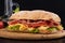 Ciabatta sandwich with lettuce , prosciutto and  cheese on wooden board