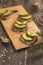 Ciabatta toasts, bruschetta with chopped avocado, olive oil, and seeds of sesame and sesame. Healthy vegetarian breakfast on