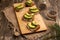 Ciabatta toasts, bruschetta with chopped avocado, olive oil, and seeds of sesame and sesame. Healthy vegetarian breakfast on