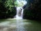 Ciangin waterfall located in West Java  Indonesia  clear water  rock cliffs