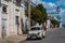 Cienfuegos, Cuba. Vintage retro American car on the street. Palacio Ferrer in Jose Marti Park, House Of The Culture Benjamin Duart