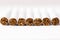 Cigarettes arranged in a row, a background